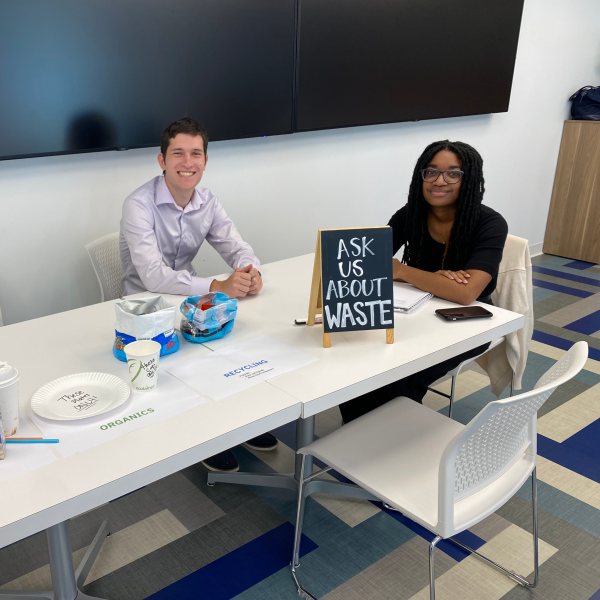 Insulet employees sitting at table displaying different waste examples